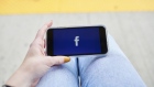The Facebook Inc. logo is displayed on an Apple Inc. iPhone in this arranged photograph taken in Greenwich, Connecticut, U.S., on Monday, April 23, 2019. As Facebook Inc. prepares to report first-quarter results Wednesday, analysts are confident that the social-media company has moved past negative headlines that dogged the stock throughout the second half of 2018 and is positioned to monetize its massive user base in new ways. Photographer: Bloomberg/Bloomberg