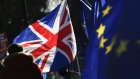 A British Union flag, also known as a Union Jack, flies beside European Union (EU) flags during ongoing pro and anti Brexit protests outside the Houses of Parliament in London, U.K., on Tuesday, Jan. 22, 2019. The U.K.’s main opposition party is backing a plan that could open the door to a second European Union referendum, bringing the possibility of stopping Brexit a step closer. Photographer: Luke MacGregor/Bloomberg