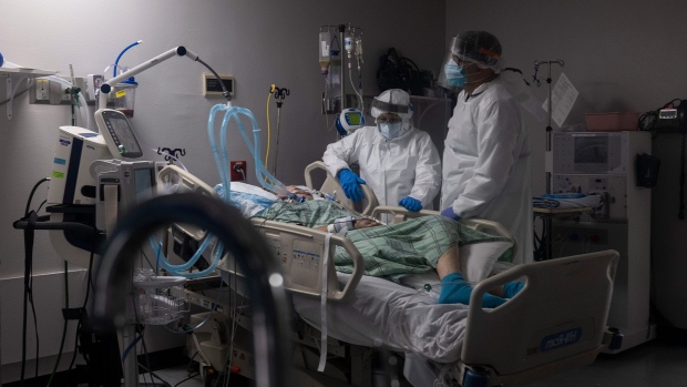 HOUSTON, TX - JULY 28: (EDITORIAL USE ONLY) Members of the medical staff treat a patient in the COVID-19 intensive care unit at the United Memorial Medical Center on July 28, 2020 in Houston, Texas. COVID-19 cases and hospitalizations have spiked since Texas reopened, pushing intensive-care units to full capacity and sparking concerns about a surge in fatalities as the virus spreads. (Photo by Go Nakamura/Getty Images)