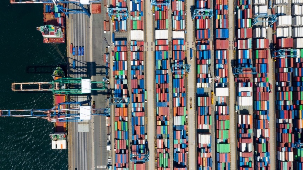 A reachstacker operates at the Sun Kwang Newport Container Terminal (SNCT) in Incheon New Port in Incheon, South Korea, on Tuesday, Feb. 25, 2020. South Korea has seen a sharp increase in coronavirus cases in the past week to more than 1,000 from just dozens, and authorities warned the fallout threatens the nation’s fragile economic recovery. Photographer: SeongJoon Cho/Bloomberg