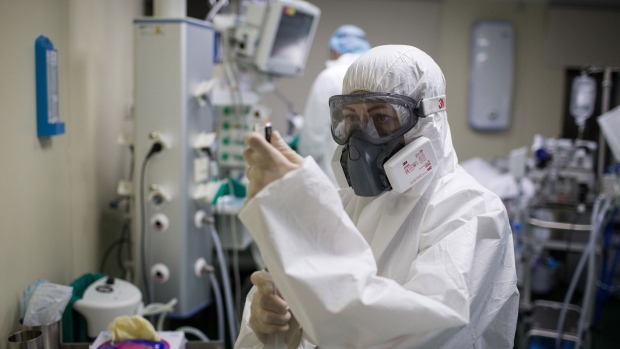 An anesthesiologist dressed in personal protective equipment (PPE) prepares an injection in the intensive care unit (ICU) at Moscow City Clinical Hospital 52 in Moscow, Russia, on Wednesday, May 13, 2020. Russia has the world’s second-highest number of coronavirus infections at 290,678 so far.
