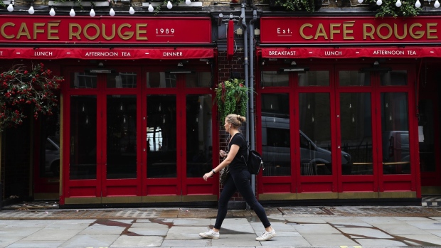 A pedestrian passes a closed Cafe Rouge restaurant, operated by Casual Dining Group Ltd., in London, U.K., on Thursday, July 9, 2020. British shops aren't getting much of a boost from newly reopened bars, cafes and restaurants as customers prefer to stay away.