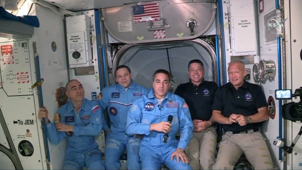 INTERNATIONAL SPACE STATION - MAY 31: In this screen grab from NASA's feed, NASA astronauts Doug Hurley (R) and Bob Behnken (2R) join NASA astronaut Chris Cassidy (C) and Russian cosmonauts, Anatoly Ivanishin (L) and Ivan Vagner (2L) aboard the International Space Station after successfully docking SpaceX's Dragon capsule May 31, 2020. The docking occurred just 19 hours after a SpaceX Falcon 9 rocket blasted off Saturday afternoon from Kennedy Space Center, the nations first astronaut launch to orbit from home soil in nearly a decade. (Photo by NASA via Getty Images)