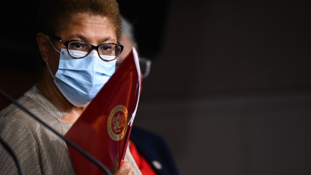 Representative Karen Bass, a Democrat from California and chair of the Democratic Black Caucus, wears a protective mask while listening during a news conference on Capitol Hill in Washington, D.C., U.S., on Wednesday, July 1, 2020. Efforts by Congress to limit the types of military equipment the Defense Department can transfer to law enforcement departments is unlikely to touch an even bigger source of advanced weapons accessible to civilian police.
