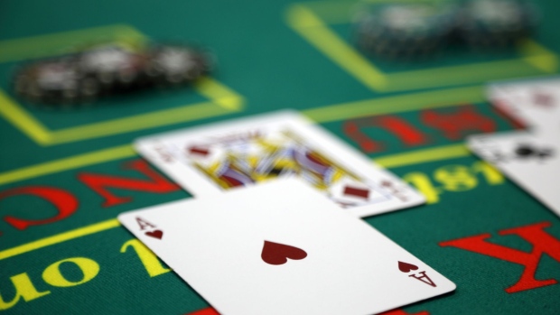 Cards sit on a blackjack table at the Japan Casino School in Tokyo, Japan, on Monday, June 16, 2014. At Japan Casino School, anticipation for the passage of the bill to legalize casinos has helped to enroll about 60 students in April, the second highest since its start in 2004, said principal Masayoshi Oiwane. Photographer: Tomohiro Ohsumi