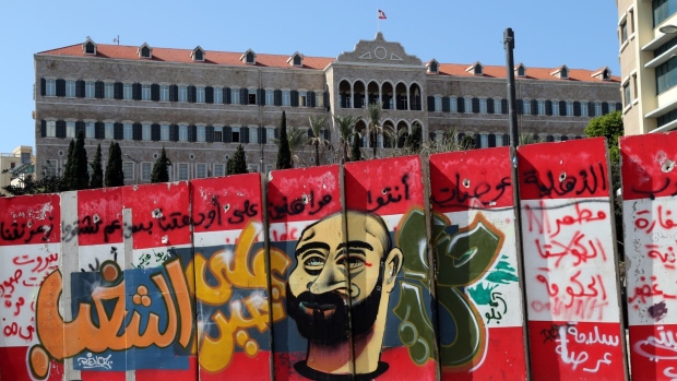 Grafitti covers a concrete barrier wall outside the Government Palace building, also known as Grand Serail in Beirut, Lebanon, on Saturday, March 7, 2020. With foreign currency reserves at what the new prime minister described as “dangerous levels,” the government is now in talks to restructure $90 billion of borrowing, which, at 170% of gross domestic product, makes Lebanon one of the most indebted countries in the world.