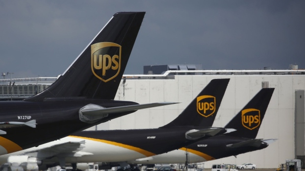 A cargo jet descends for landing at the UPS Worldport facility in Louisville, Ky., U.S., on July 31.