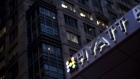 Illuminated signage is displayed outside the Hyatt Place hotel in Chicago. Photographer: Christopher Dilts/Bloomberg