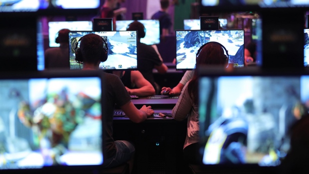 Gamers play the 'World of Warcraft' computer game at the Gamescom gaming industry event in Cologne, Germany, on Tuesday, Aug. 21, 2018. Gamescom is Germany's largest congress revolving around digital games, and acts as an interface with other cultural and creative branches, as well as with the digital economy according to their media site. Photographer: Krisztian Bocsi/Bloomberg