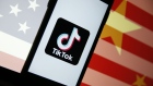 The TikTok logo sits displayed on a smartphone in front of an image of the national flags of China and the U.S. in this arranged photograph in London, U.K., on Monday, Aug. 3, 2020. TikTok has become a flash point among rising U.S.-China tensions in recent months as U.S. politicians raised concerns that parent company ByteDance Ltd. could be compelled to hand over American users’ data to Beijing or use the app to influence the 165 million Americans, and more than 2 billion users globally, who have downloaded it.