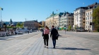 Pedestrians walk near the habour in Stockholm, on May 22.  
