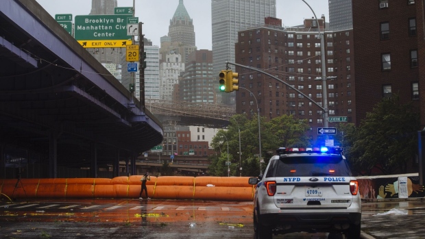 A flood barrier stretches across a street during Tropical Storm Isaias in New York on Aug. 4.