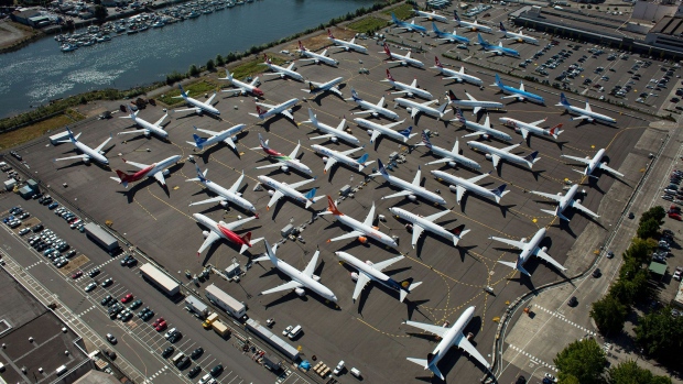 Boeing 737 MAX airplanes are seen parked on Boeing property along the Duwamish River near Boeing Field on August 13, 2019 in Seattle, Washington. Photographer: David Ryder/Getty Images