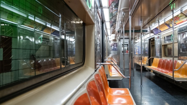 Empty subway seats are seen on a train in New York, U.S., on Wednesday, June 10, 2020. New York streets got a little more congested this week as the city entered Phase 1 of its re-opening from the coronavirus-imposed lockdown. Photographer: Jeenah Moon/Bloomberg