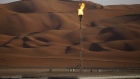 Flames burn off at an oil processing facility in Saudi Aramco's oilfield in the Rub' Al-Khali (Empty Quarter) desert in Shaybah, Saudi Arabia, on Tuesday, Oct. 2, 2018. Saudi Aramco aims to become a global refiner and chemical maker, seeking to profit from parts of the oil industry where demand is growing the fastest while also underpinning the kingdom’s economic diversification. Photographer: Simon Dawson/Bloomberg