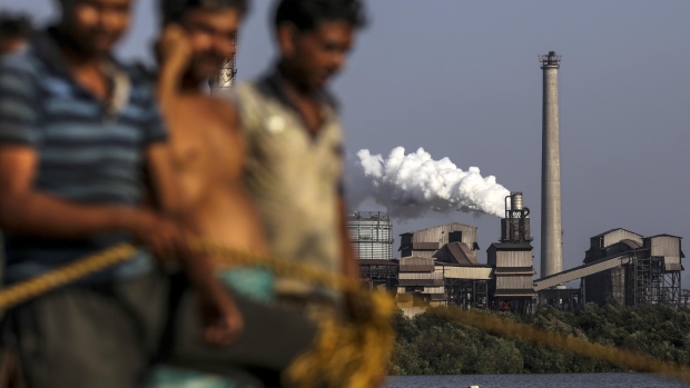 Steam rises from the JSW Steel Ltd. manufacturing facility stands in Dolvi, Maharashtra, India, on Thursday, May 18, 2017. JSW, India's biggest producer, reported a jump in fourth-quarter profit, boosted by record output, and said it approved plans to raise about $2.5 billion in debt.