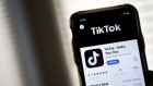 WASHINGTON, DC - AUGUST 07: In this photo illustration, the download page for the TikTok app is displayed on an Apple iPhone on August 7, 2020 in Washington, DC. On Thursday evening, President Donald Trump signed an executive order that bans any transactions between the parent company of TikTok, ByteDance, and U.S. citizens due to national security reasons. The president signed a separate executive order banning transactions with China-based tech company Tencent, which owns the app WeChat. Both orders are set to take effect in 45 days. (Photo Illustration by Drew Angerer/Getty Images)