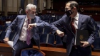 Jerome Powell, chairman of the U.S. Federal Reserve, left, and Steven Mnuchin, U.S. Treasury secretary, wear protective masks while greeting each other with an elbow bump during a House Financial Services Committee hearing in Washington, D.C., U.S., on Tuesday, June 30, 2020. The Federal Reserve is preparing for the possibility of an economically debilitating second wave of coronavirus infections even as it's hoping that can be avoided.