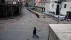 A pedestrian passes in front of the New York Stock Exchange (NYSE) in New York, U.S., on Monday, July 20, 2020. U.S. stocks fluctuated in light trading as investors are keeping an eye on Washington, where lawmakers will begin hammering out a rescue package to replace some of the expiring benefits earlier versions contained.