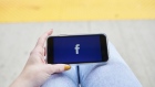 The Facebook Inc. logo is displayed on an Apple Inc. iPhone in this arranged photograph taken in Greenwich, Connecticut, U.S., on Monday, April 23, 2019.