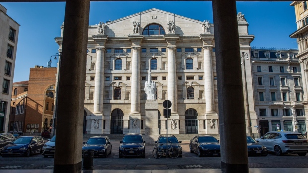 A sculpture entitled 'L.O.V.E.' by Italian artist Maurizio Cattelan, stands in front of Italy's Stock Exchange, the Borsa Italiana which is part of the London Stock Exchange Group Plc, in Milan, Italy, on Wednesday, April 8, 2020. Italy is beginning to look at easing its lockdown after Denmark and Austria became the first two European countries to loosen restrictions as governments seek to gradually revive economies crippled by the containment measures without risking a second wave of infection.