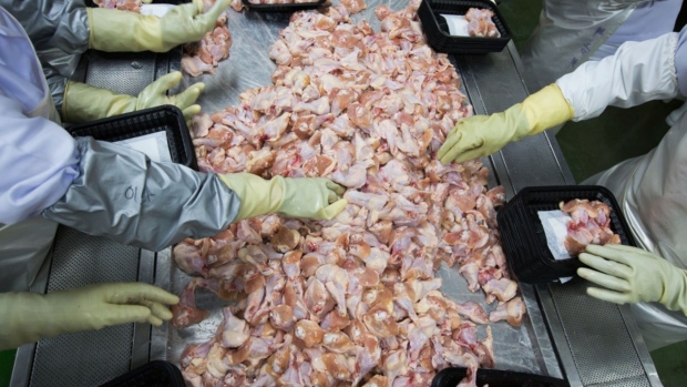 Employee package sliced chicken legs and wings at the Harim Co. factory in Iksan, South Korea