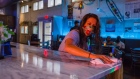 A worker disinfects a bar at a nightclub in Columbia, South Carolina. Photographer: Micah Green/Bloomberg