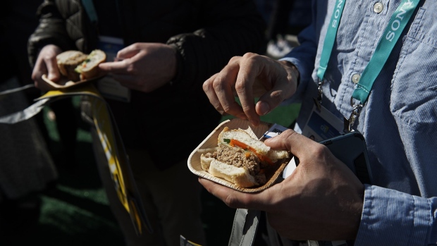 An attendee holds a sandwich made with plant-based pork product served at the Impossible Foods Inc. booth during CES 2020 in Las Vegas, Nevada, U.S., on Tuesday, Jan. 7, 2020. Every year during the second week of January nearly 200,000 people gather in Las Vegas for the tech industry's most-maligned, yet well-attended event: the consumer electronics show. Photographer: Bridget Bennett/Bloomberg