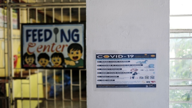 A Covid-19 safety sign is displayed at the the Rosauro Almario Elementary School in Manila City, July 21, 2020. Coronavirus cases in the Philippines have more than tripled since stay-home orders in the capital were lifted and most businesses were allowed to reopen starting June. Photographer: Veejay Villafranca/Bloomberg