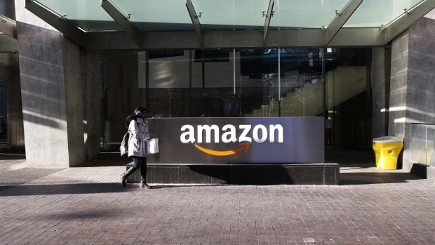 A pedestrian walks past the Amazon.com Inc. headquarters in the financial district of Toronto, Ontario, Canada, on Friday, Feb. 21, 2020. 