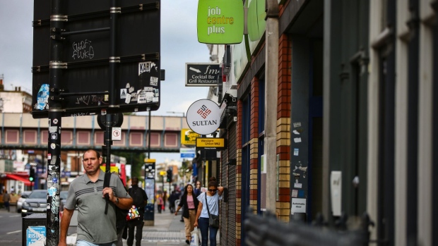 Pedestrians pass a job centre plus employment office in London, U.K., on Friday, July 24, 2020. Almost half of businesses taking part in the U.K. government's coronavirus jobs program expect to let go of furloughed staff when support ends in October.