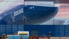 A worker walks outside of a Boeing Co. facility in Everett, Washington, U.S., on Wednesday, May 27, 2020. Boeing Co. unveiled the first and deepest of its planned job cuts, saying it would notify 6,770 employees in the U.S. this week that their positions would be eliminated.