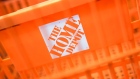 Home Depot Inc. signage is displayed on a shopping basket inside a store in New York, U.S., on Sunday, Aug. 16, 2020. Home Depot is scheduled to release earnings figures on August 18. Photographer: Jeenah Moon/Bloomberg