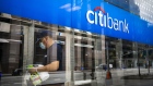A worker wearing a protective mask cleans automated teller machines (ATM) at a Citigroup Inc. Citibank branch in New York, U.S., on Friday, April 10, 2020. Citigroup is scheduled to release earnings figures on April 15.