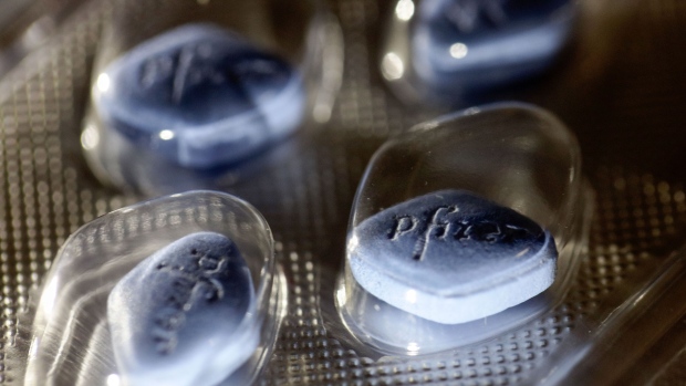 The Pfizer logo sits on Viagra tablets, produced by Pfizer Inc., inside a blister pack sitting on a pharmacy counter in this arranged photograph in London, U.K., on Monday, Dec. 14, 2015. European pharmaceuticals stocks in 2015 have outperformed the Stoxx 600 Index by 1.2 percentage points in U.S. dollar terms. Photographer: Bloomberg/Bloomberg