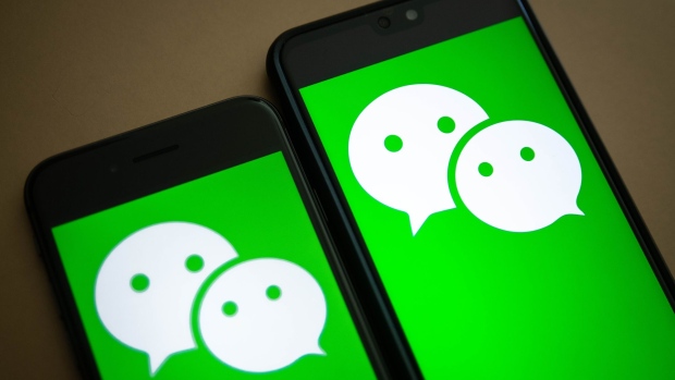 The logo for Tencent Holdings Ltd.'s WeChat app is arranged for a photograph on smartphones in Hong Kong, China, on Friday, Aug. 7, 2020. President Donald Trump signed a pair of executive orders prohibiting U.S. residents from doing business with the Chinese-owned TikTok and WeChat apps beginning 45 days from now, citing the national security risk of leaving Americans' personal data exposed. Photographer: Ivan Abreu/Bloomberg