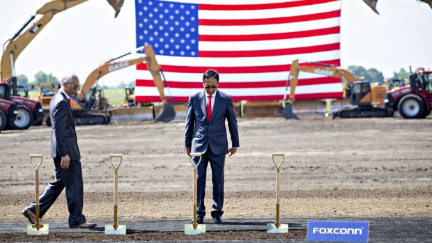 Billionaire Terry Gou, chairman of Foxconn Technology Group, looks over a row of ceremonial shovels ahead of a groundbreaking ceremony for the Foxconn Technology Group facility in Mount Pleasant, Wisconsin, U.S., on Thursday, June 28, 2018. After repeatedly bashing the leadership of Harley-Davidson Inc. this week, President Donald Trump is set to be 30 miles away from its corporate headquarters during the groundbreaking for the Foxconn Technology Group electronic screen manufacturing campus.