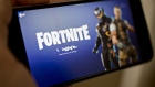 The Epic Games Inc. Fortnite: Battle Royale video game is displayed for a photograph on an Apple Inc. iPhone in Washington, D.C., U.S., on Thursday, May 10, 2018. Fortnite, the hit game that's denting the stock prices of video-game makers after signing up 45 million players, didn't really take off until it became free and a free-for-all. 
