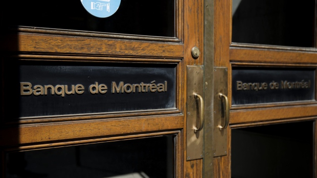 Bank of Montreal (BMO) signage is displayed on doors at the company's headquarters in Montreal, Quebec, Canada, on Sunday, Aug. 19, 2018. Median single-family home prices in Montreal rose 5.7% to C$336,250 in July from a year ago, according to the Greater Montreal Real Estate Board (GMREB). Photographer: Brent Lewin/Bloomberg