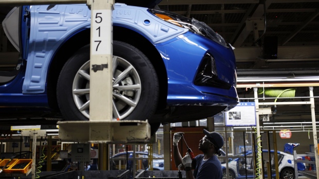 An employee uses a drill underneath a vehicle on the production line at the Hyundai Motor Manufacturing Alabama (HMMA) facility in Montgomery, Alabama, U.S., on Wednesday, July 19, 2017. The U.S. Census Bureau is scheduled to release durable goods figures on July 27. Photographer: Luke Sharrett/Bloomberg