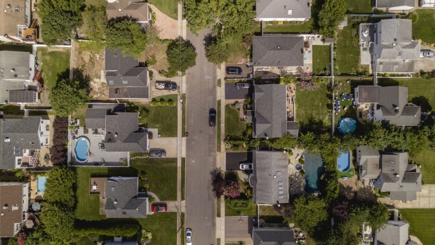 Homes stand in an aerial photograph taken over Merrick, New York, U.S., on Monday, Aug. 26, 2019. Few markets are more copacetic to flippers right now than Long Island, whose 2.8 million residents live in a range of socio-economic groupings, from traffic-clogged commuter communities to lunch-pail fishing towns to the opulent beach hamlets of the Hamptons. Photographer: Johnny Milano/Bloomberg