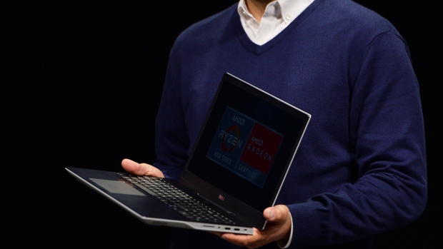 Frank Amor, chief architect of gaming solutions for Advanced Micro Devices Inc. (AMD), presents the Dell Inc. G5 SE laptop computer during an AMD press event at CES 2020 in Las Vegas, Nevada, U.S., on Monday, Jan. 6, 2020.