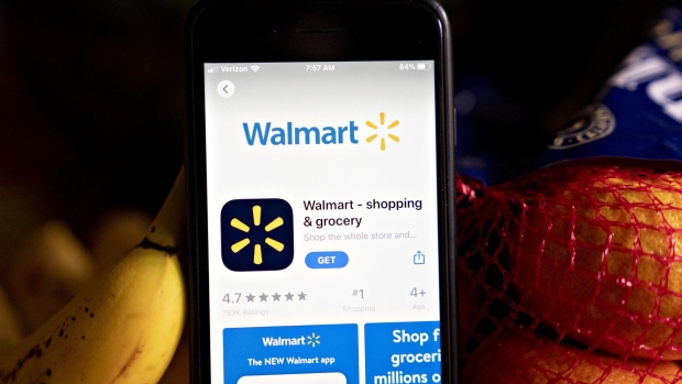 The Walmart application is displayed in the App Store on a smartphone in an arranged photograph taken in Arlington, Virginia, U.S., on Tuesday, May 19, 2020. Walmart Inc. posted strong quarterly sales fueled by coronavirus-related stockpiling, showing how it's one of the few retailers thats thriving even amid the unprecedented carnage in the U.S. retail sector. Photographer: Andrew Harrer/Bloomberg