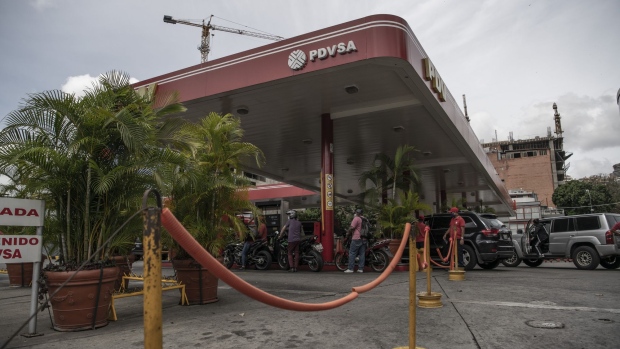 Vehicles wait in line to refuel at a Petroleos de Venezuela SA (PDVSA) gas station in Caracas, Venezuela, on Monday, June 1, 2020. Venezuela’s President Nicolas Maduro said fuel prices would increase starting in June, a historic policy shift after decades of subsidies that have allowed Venezuelans to essentially fill their tanks for free.