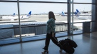 A traveler walks past United Airlines Holdings Inc. airplanes parked at Newark International Airport (EWR) in Newark, New Jersey, U.S., on Tuesday, June 9, 2020. Airline losses are surging to unprecedented levels expected to be more than three times those following the 2008 global economic slump, according to the industry's main trade group. Photographer: Bloomberg/Bloomberg