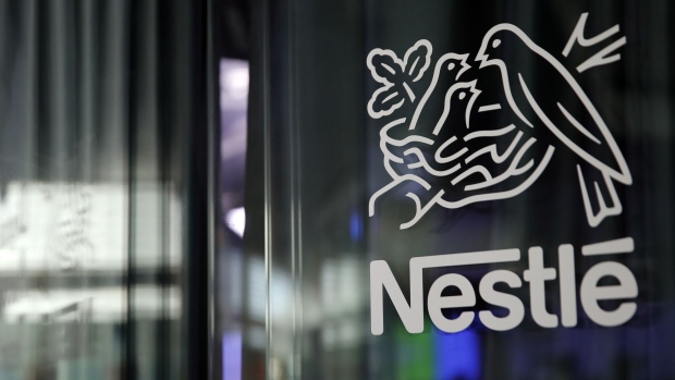A bird's nest logo sits on display at the Nestle SA headquarters in Vevey, Switzerland, on Wednesday, Feb. 12, 2019. While Nestle’s 2019 sales growth accelerated, analysts doubt the world’s largest food company will achieve growth above 4% this year. Photographer: Stefan Wermuth/Bloomberg