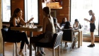 Customers dine at a restaurant in Toronto, Ontario, Canada, on Friday, July 31, 2020. In Stage 3, indoor dining can resume at bars and restaurants and the size of gatherings can increase to 50 indoors and 100 outdoors. Photographer: Cole Burston/Bloomberg