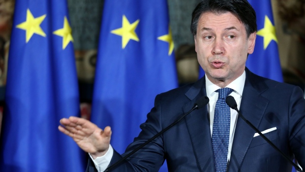 Giuseppe Conte, Italy's prime minister, speaks during a joint news conference with Emmanuel Macron, France's president, not pictured, at a bilateral summit in Naples, Italy, on Thursday, Feb. 27, 2020. Macron and Conte staged a show of friendship with a summit designed to turn the page on a postwar low in bilateral relations, even as coronavirus concerns overshadowed the meetings agenda.
