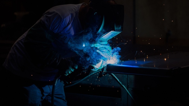 A worker welds parts for a ballot drop box inside a manufacturing facility in Puyallup, Washington. Photographer: Chona Kasinger/Bloomberg