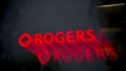 Rogers Communications Inc. signage illuminated at night is seen in this long exposure photograph taken in Toronto, Ontario, Canada, on Wednesday, May 17, 2017. Rogers Communications, Canada's largest wireless carrier, is leveraging organic growth in the country's wireless market to expand its subscriber base.